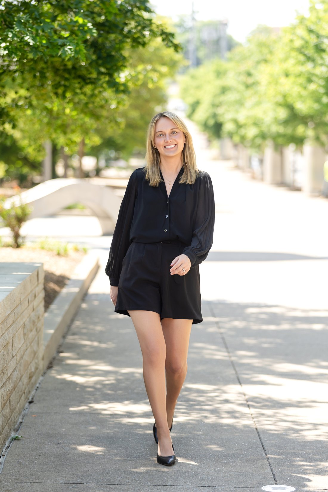 An individual business portrait, walking toward camera