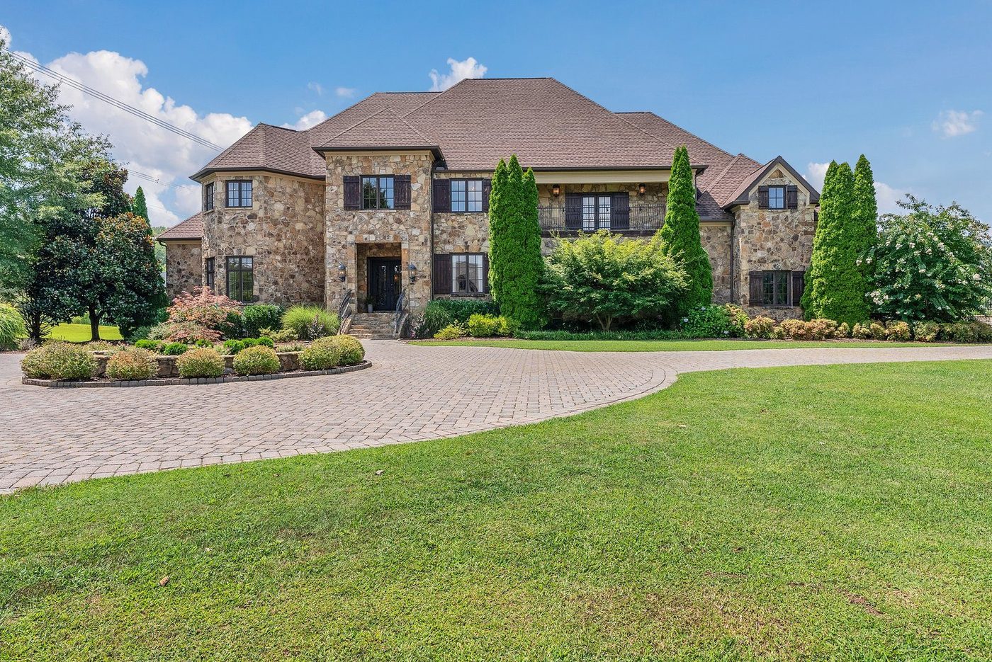 The front elevation of a stone home in Nashville, shot in clear daylight